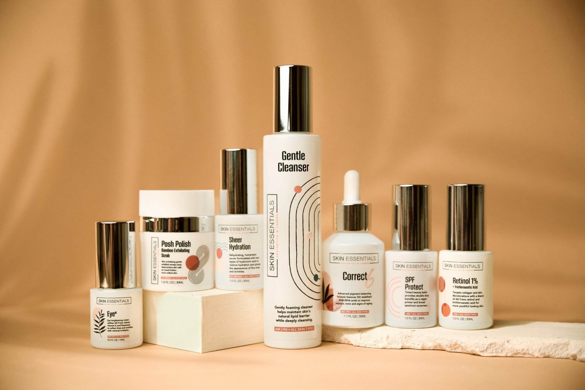 A collection of Bamboo Exfoliating Polish on a beige background.