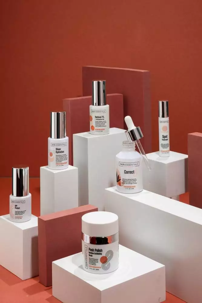 A collection of skincare products on a red background. A collection of skincare products on a red background.
